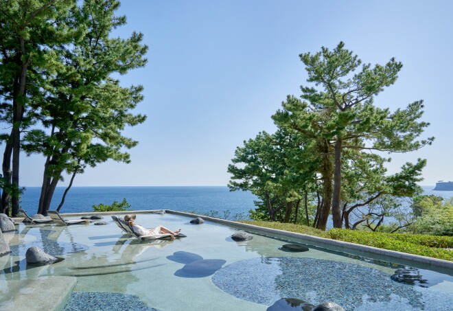 The pool at JW Marriott Jeju Resort & Spa faces the blue horizon of the Korea Strait.