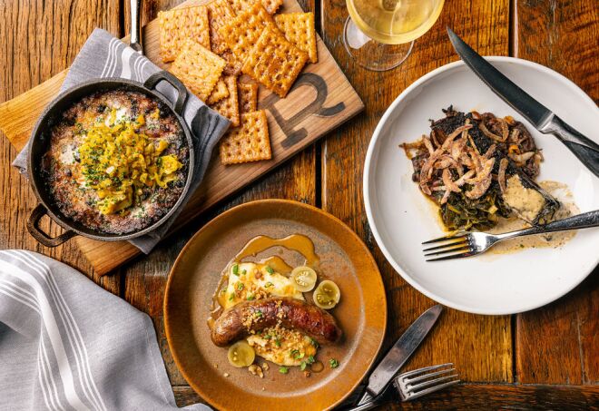 A rustic table filled with Appalachian dishes at the restaurant Rhubarb in Asheville