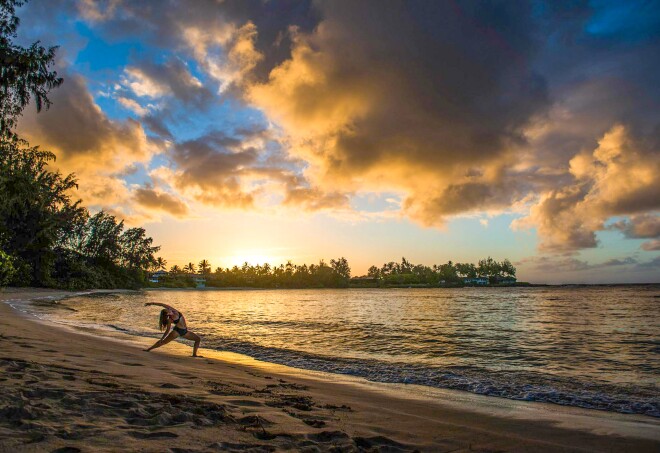 You can bask in the beauty of nature while doing yoga along Kawela Bay at Turtle Bay